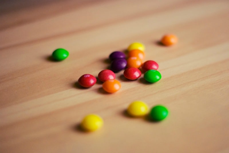 skittles on a wooden table