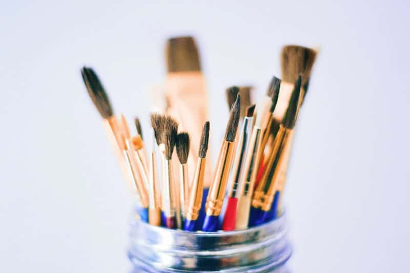 a jar of paintbrushes