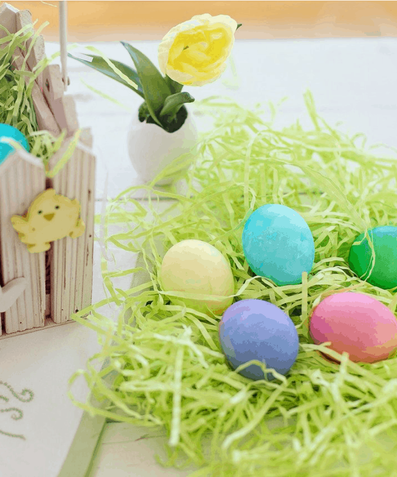 Easter eggs in plastic green grass