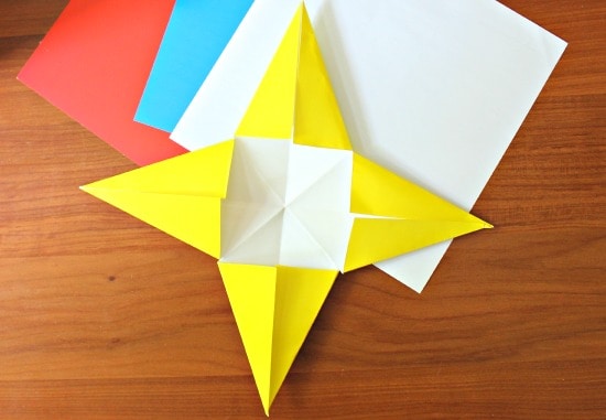a yellow origami star with red white and blue paper