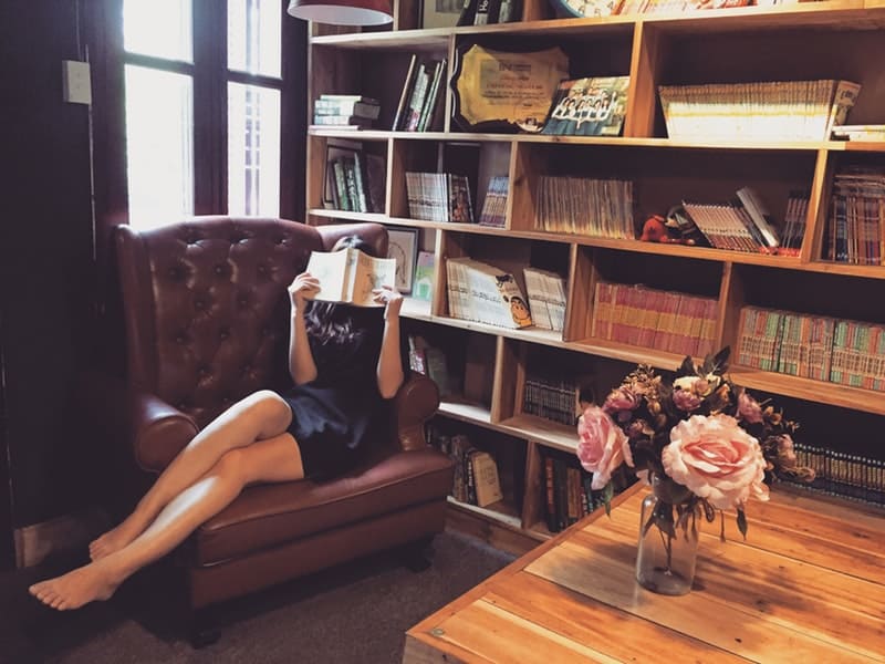 a woman reading in a library