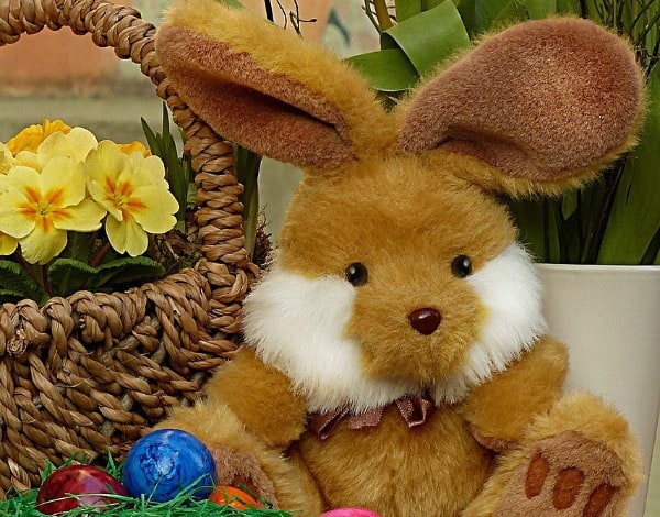 a stuffed Easter bunny near a basket