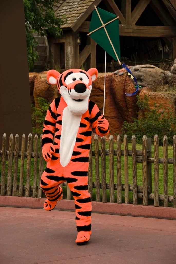 Tigger holding a kit on a string