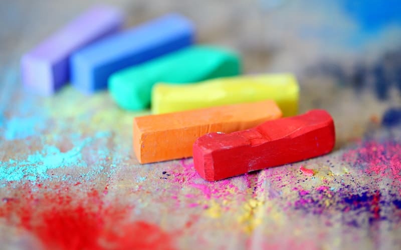 colorful pieces of chalk on cardboard