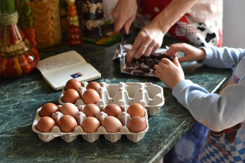 children cooking with eggs