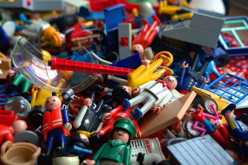 playmobil toys in a pile