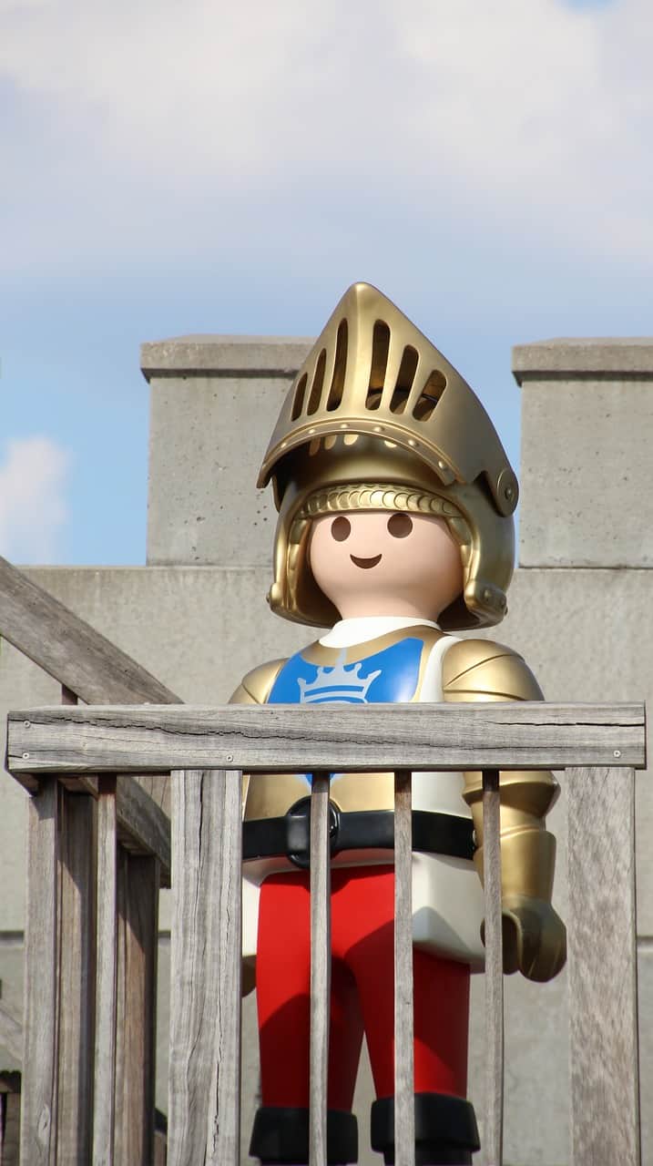a play knight standing in a castle