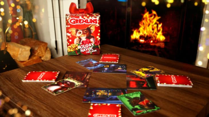 a pack of cards on a table in front of a fire place