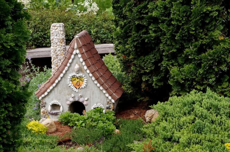 a miniature house in the garden