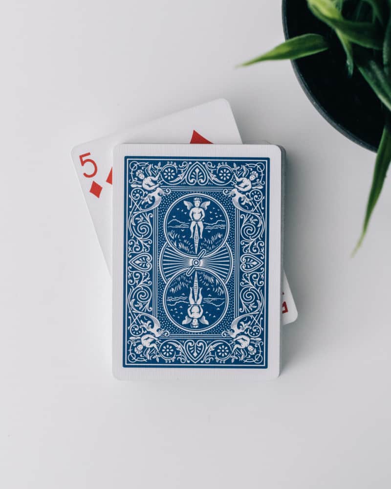 a deck of cards on a white table