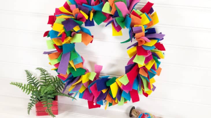 Check out this Rainbow Felt Wreath DIY. Learn how to make a wreath with felt strips with this simple tutorial the kids can help with.