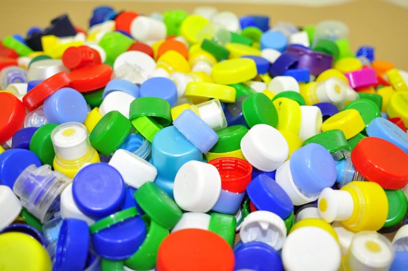 a colorful pile of plastic bottle caps