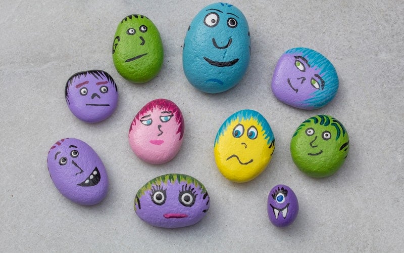 colorful painted rocks with faces