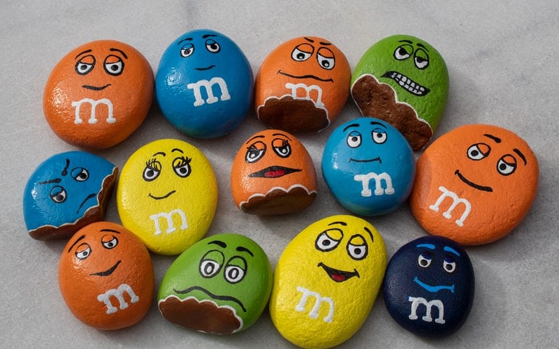 colorful rocks with faces painted on them