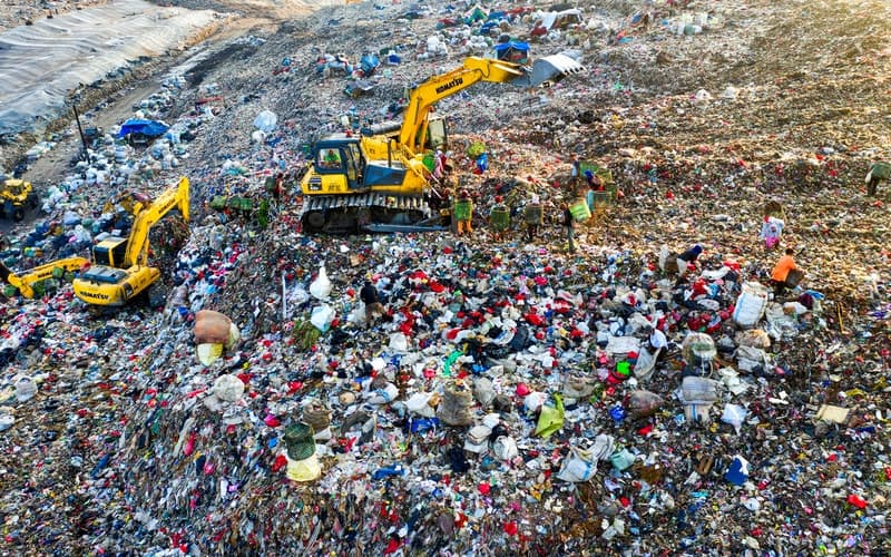 a landfill with trucks
