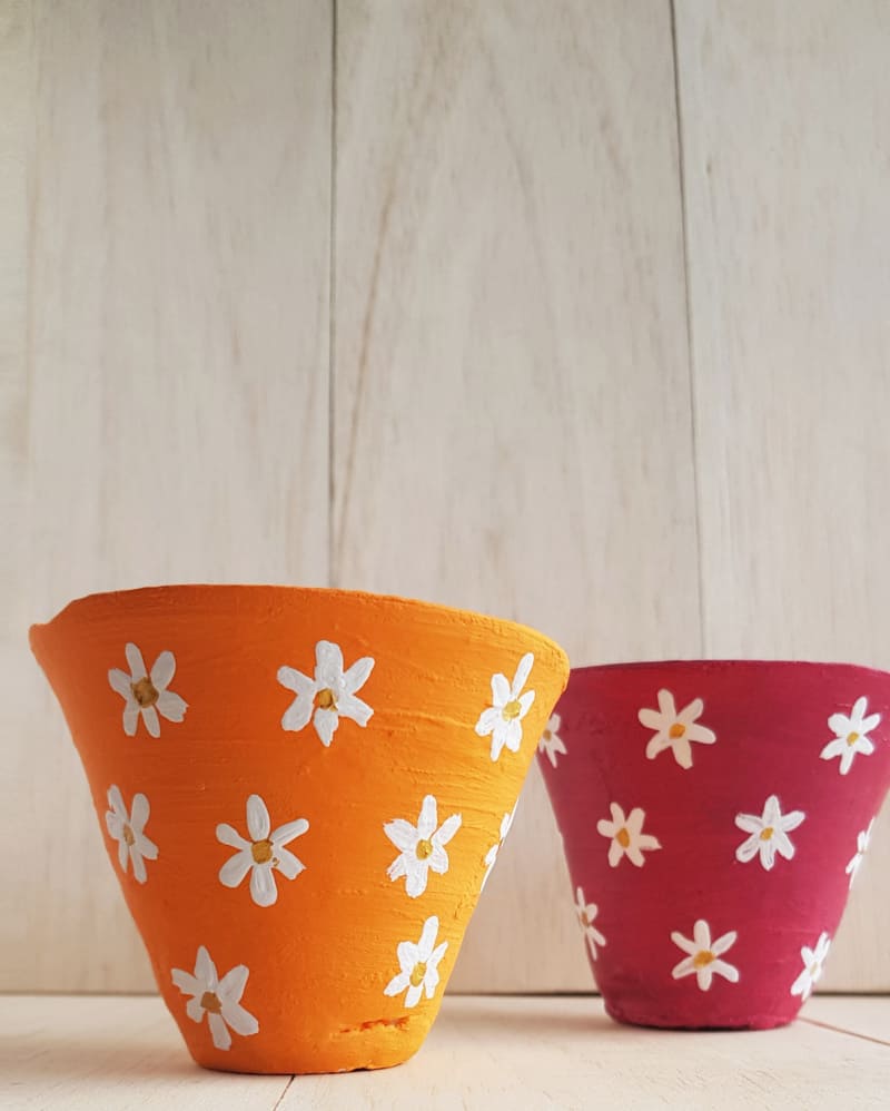 Learn more about flower pot painting for kids. Check out this easy tutorial to make painted flower pots with your child.