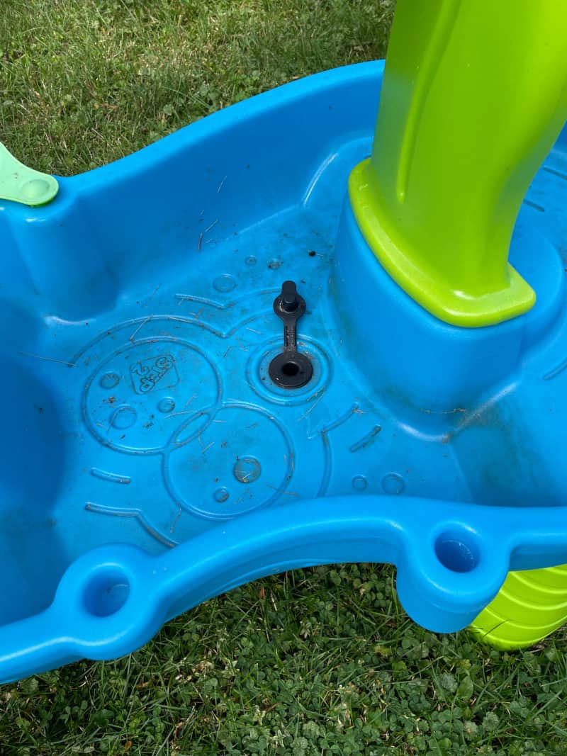 a dirty water table in the grass