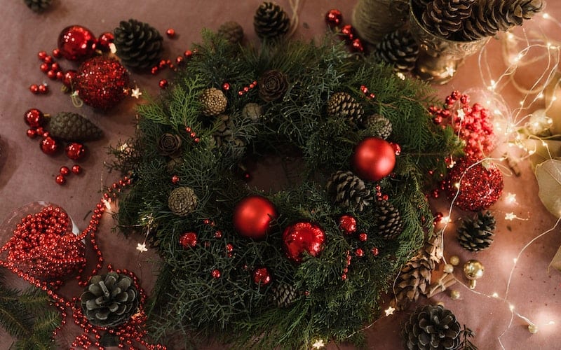 a wreath and decorations on the table