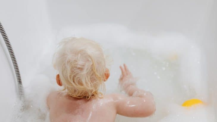 child in the bath tub