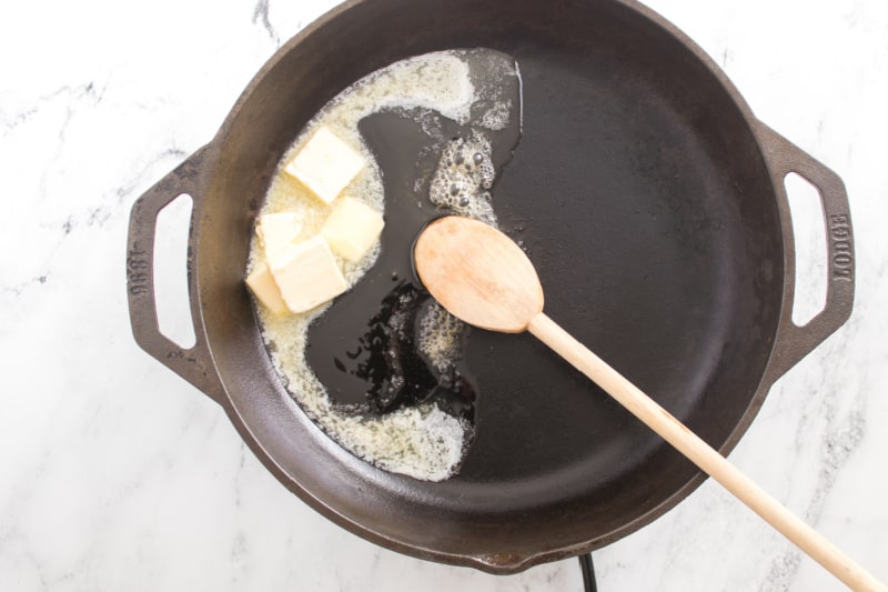 melting butter in a cast iron skillet