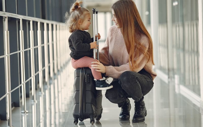 mom and toddler in an airport
