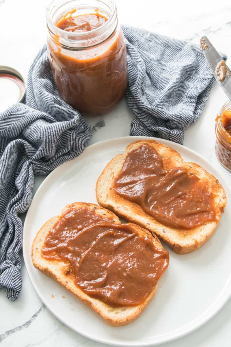 This pumpkin apple butter has all the flavor of crisp apples and canned pumpkin puree. Make this pumpkin apple butter recipe today.