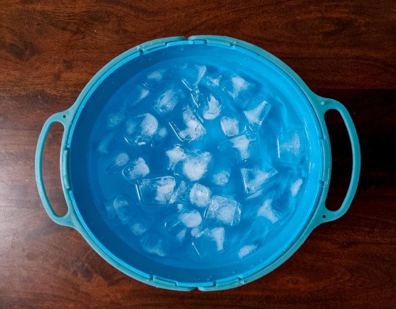 ice cubes in a blue bucket