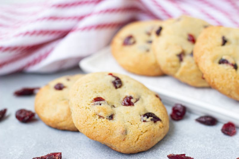 gluten free cookies on a plate with cranberries