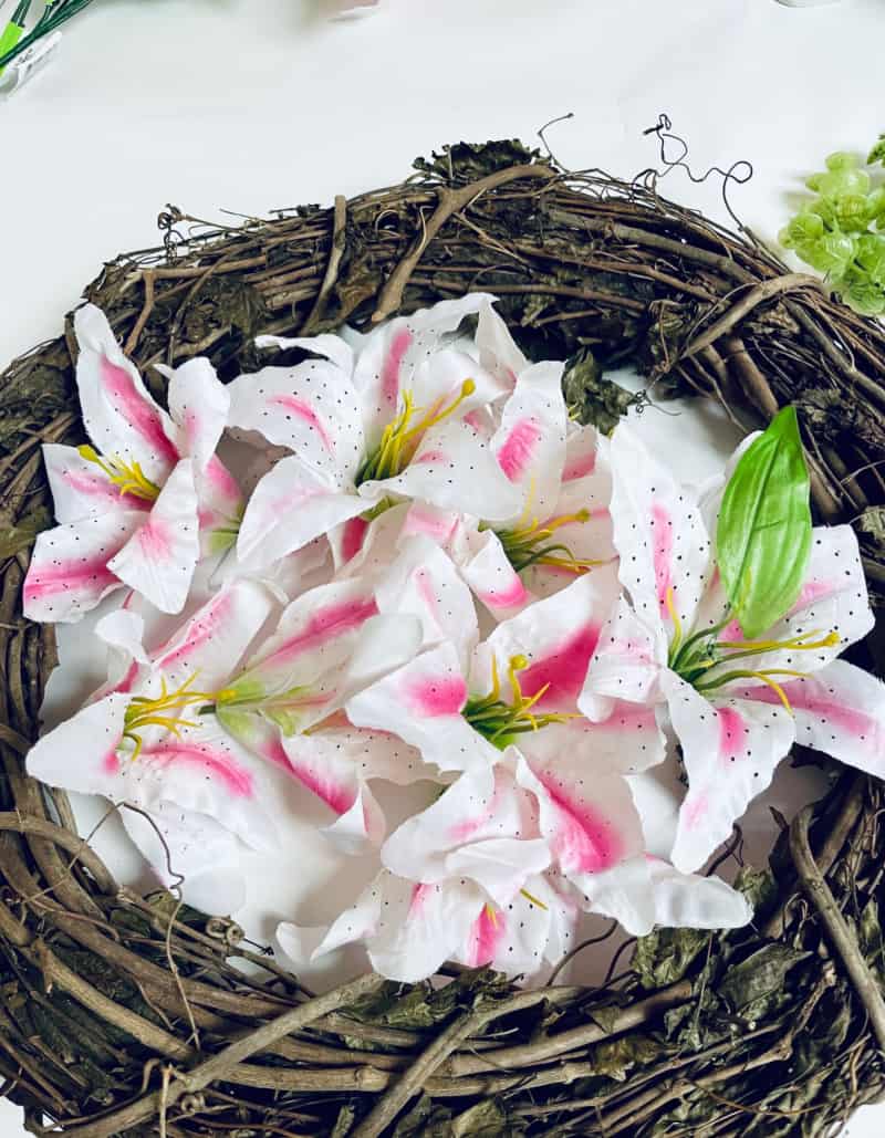 pink and white flowers and a grapevine wreath