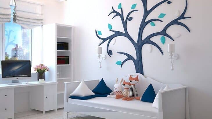 a small bedroom with white walls and storage space