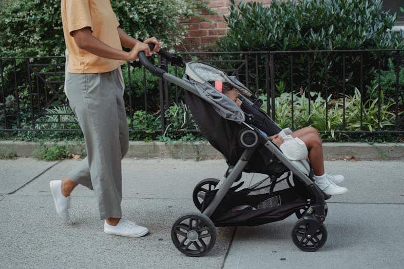 woman pushing a child in a stroller