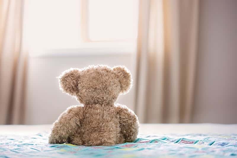 stuffed teddy bear toy on the bed