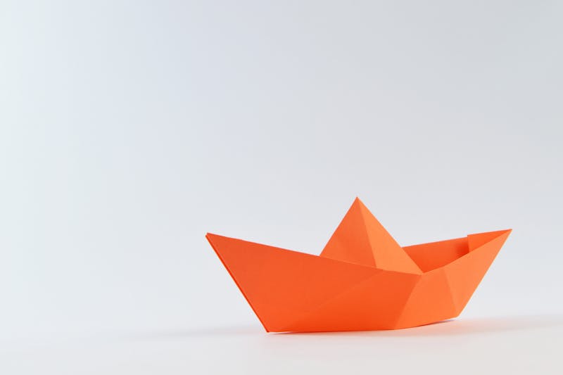 orange boat made of paper