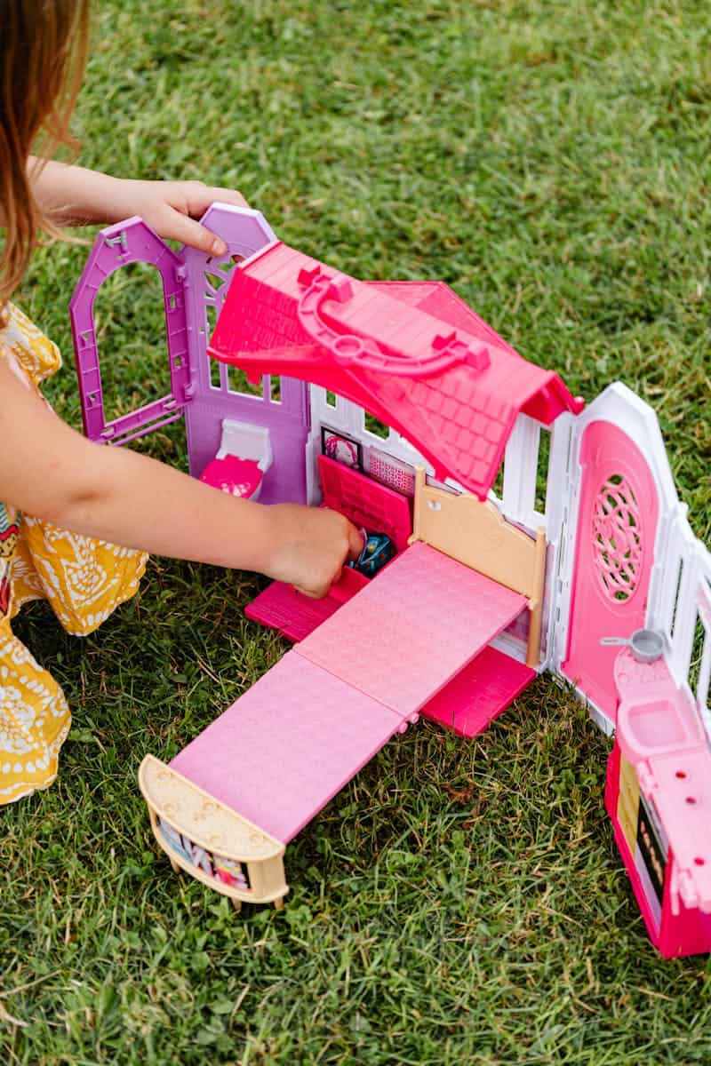 girl playing with a Barbie set