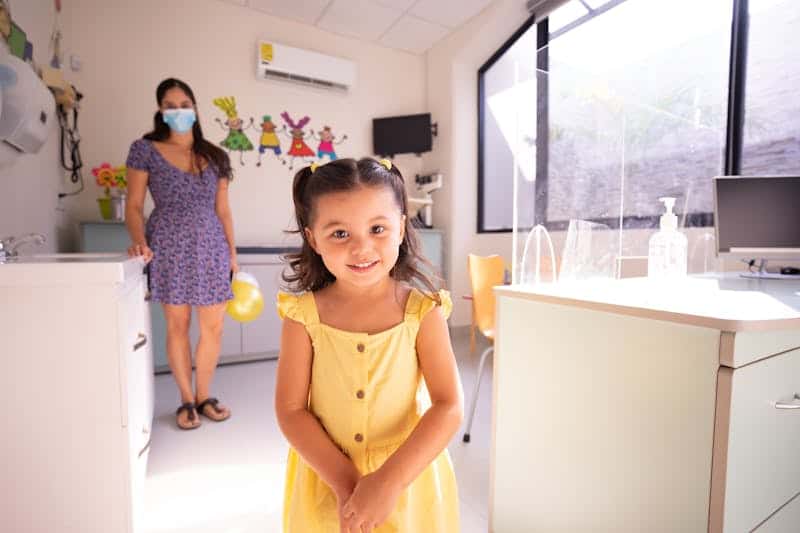 girl wearing a yellow dress at the doctors