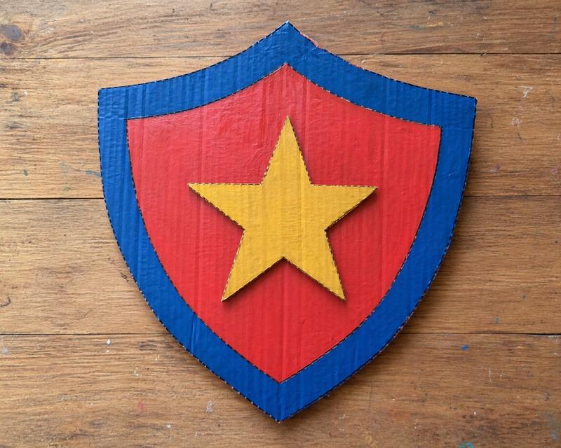 Cardboard shields decorated with stickers or markers