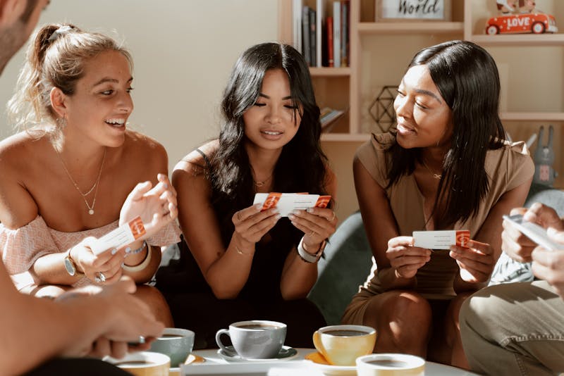 3 women playing a trivia game