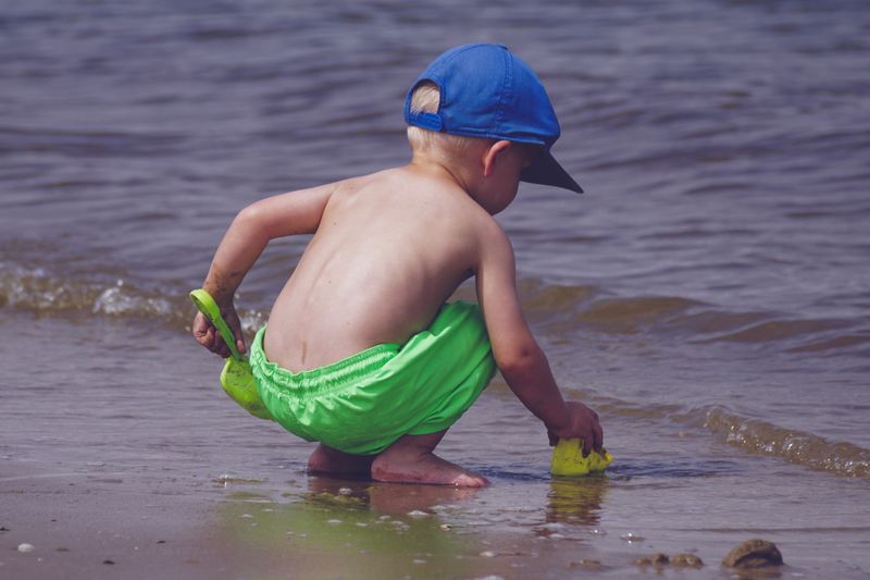 boy playing on the beach