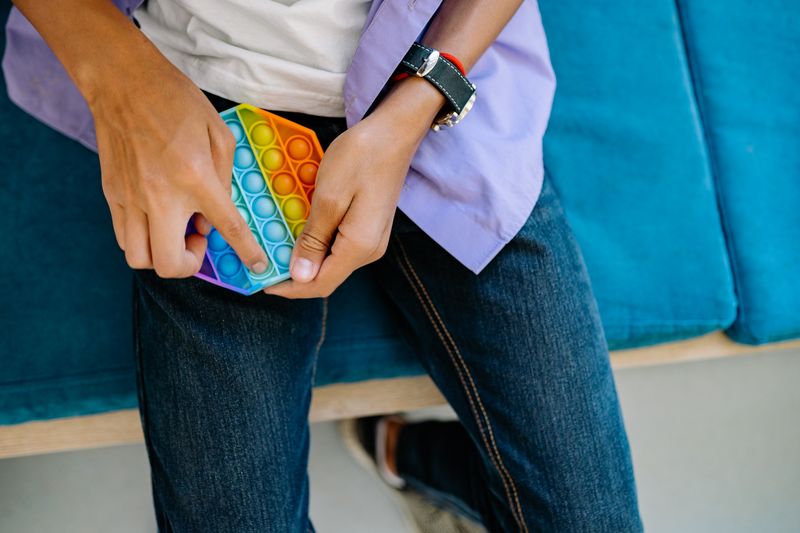 child using a fidget toy