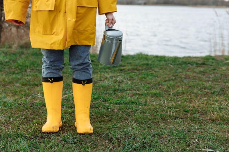 child wearing yellow rain boots